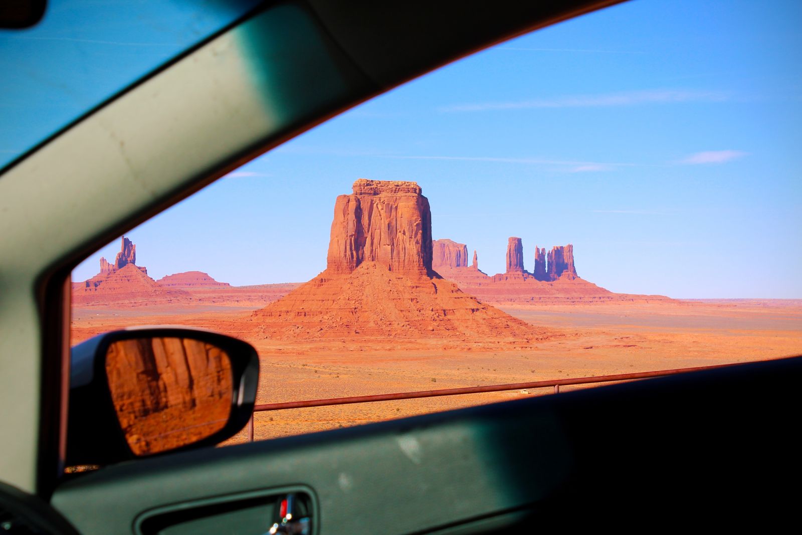 Monument Valley buttes seen through the window of a car